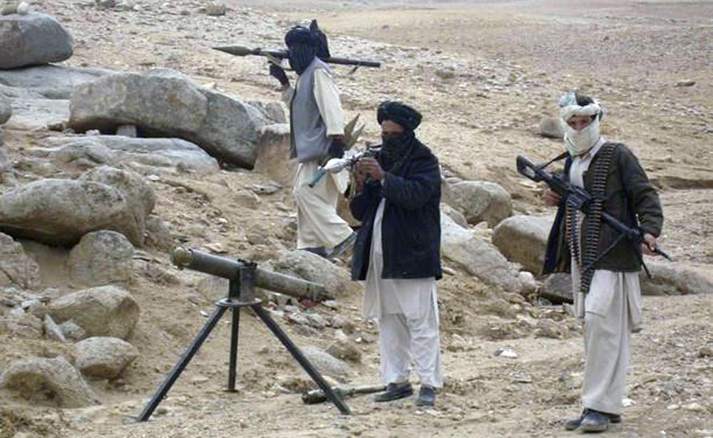 In this file photo, Taliban fighters pose with weapons in an undisclosed location in Afghanistan, Oct. 30, 2009. (REUTERS)