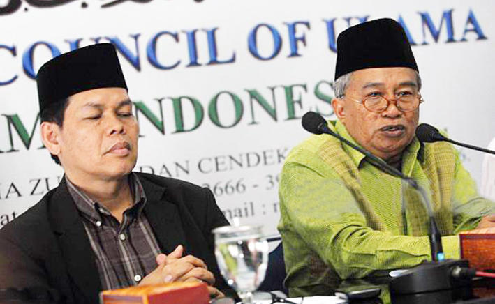 Indonesia Ulema Council chief, Muhyiddin Junaidi, right, with an MUI official Amirsyah Tambunan. (AFP/file)