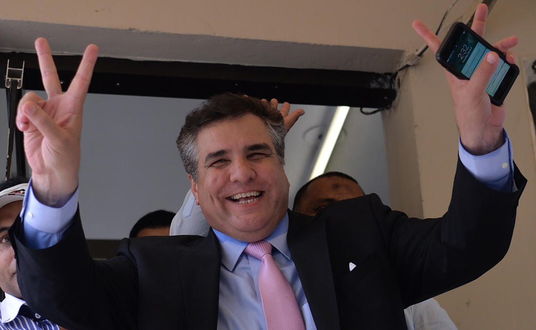 In this file photo, leader of ruling party Pakistan Muslim League-Nawaz (PML-N) Daniyal Aziz gestures as he celebrates after a Supreme Court verdict on the Panama Papers case outside the court building in Islamabad on April 20, 2017. (AFP)