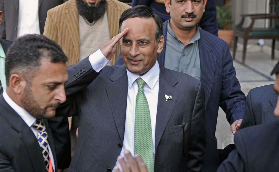 In this file photo, Pakistan’s former ambassador to the US Husain Haqqani, center, gestures as he leaves The High Court Building in Islamabad on Jan 9, 2012. (AFP)