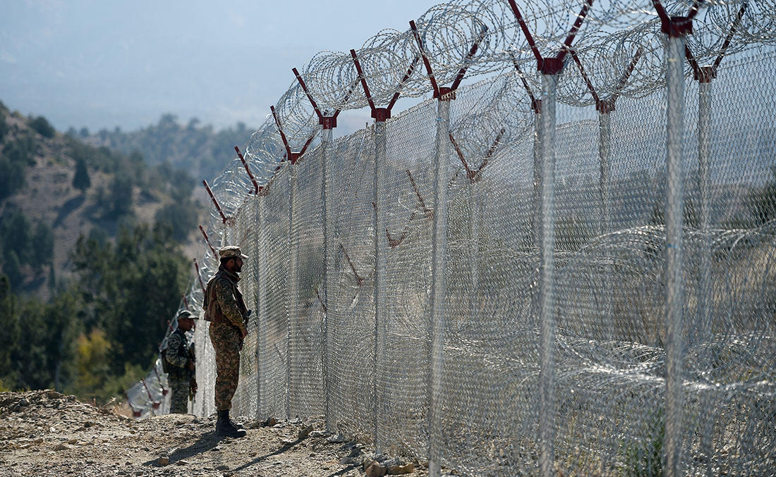 In this file photo, Pakistani soldiers keep vigil next to newly fenced border fencing along with Afghan's Paktika province border in Angoor Adda in Pakistan's South Waziristan tribal agency on Oct. 18, 2017. (AFP)