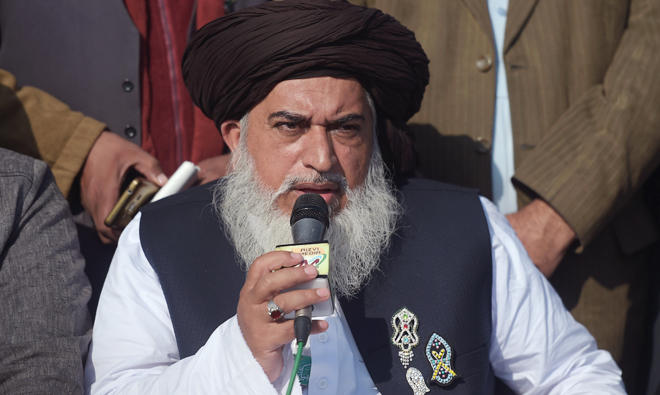 In this file photo, Pakistani head of the Tehreek-i-Labaik Yah Rasool Allah Pakistan (TLYRAP) religious group Khadim Hussain Rizvi announces the end of sit-in protest on a blocked flyover bridge during a press conference in Islamabad. (AFP)