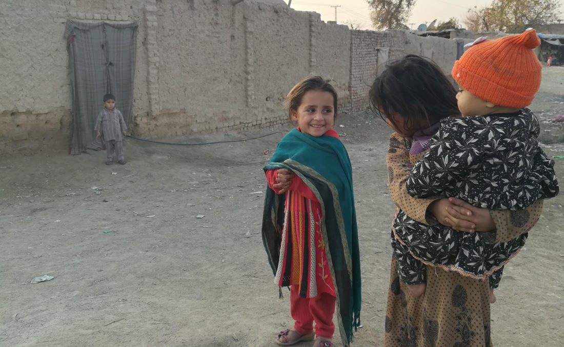 Children outside their mud-houses in the Ghundo refugee camp in the suburbs of Peshawar. (AN photo by Shahid Shalmani)