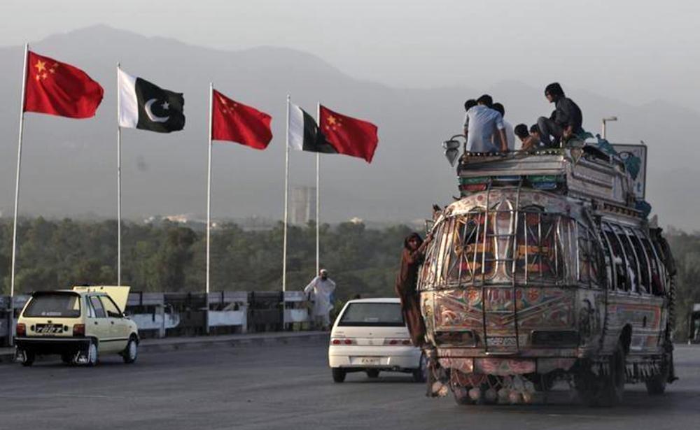 In this file photo, flags of Pakistan and China are displayed along a road in Islamabad on May 21, 2013. (REUTERS)