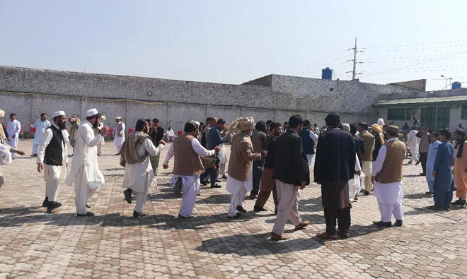 Tribal elders dance at FATA Jirga in Peshawar on Sunday.