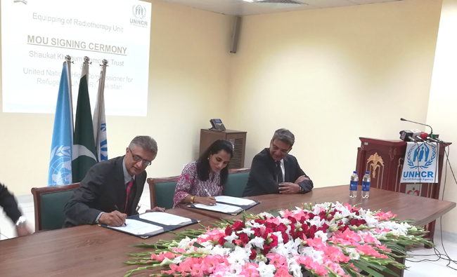 UNHCR Pakistan Representative Ms Ruvendrini Menikdiwela (center) and hospital’s CEO Dr. Faisal Sultan signing the agreeement. (AN photos)