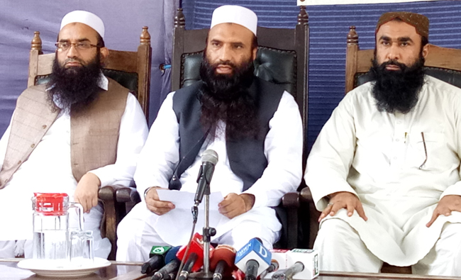 President of Milli Muslim League, Saifullah Khalid (center), along with other office-bearers addresses at Karachi Press Club on April, 4, 2018. (AN photos)