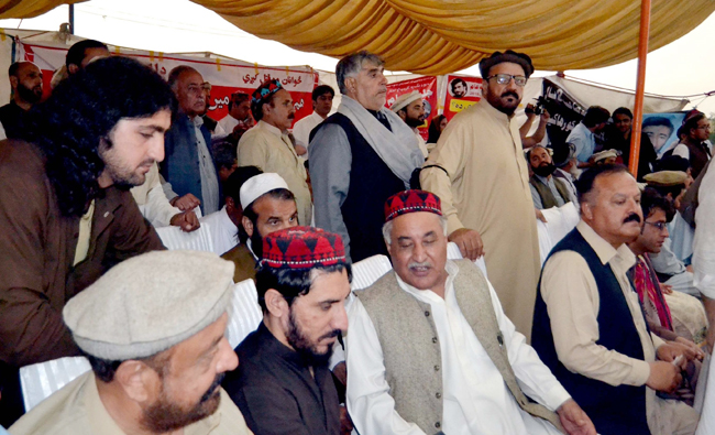 Manzoor Pashteen (second from left) on stage during the rally in Peshawar.