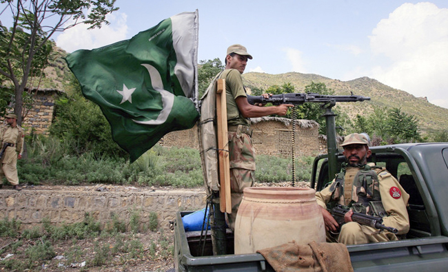 In this file photo, Pakistani soldiers patrol Tora Warai, a town in Kurram Agency, on the border with Afghanistan. (REUTERS)