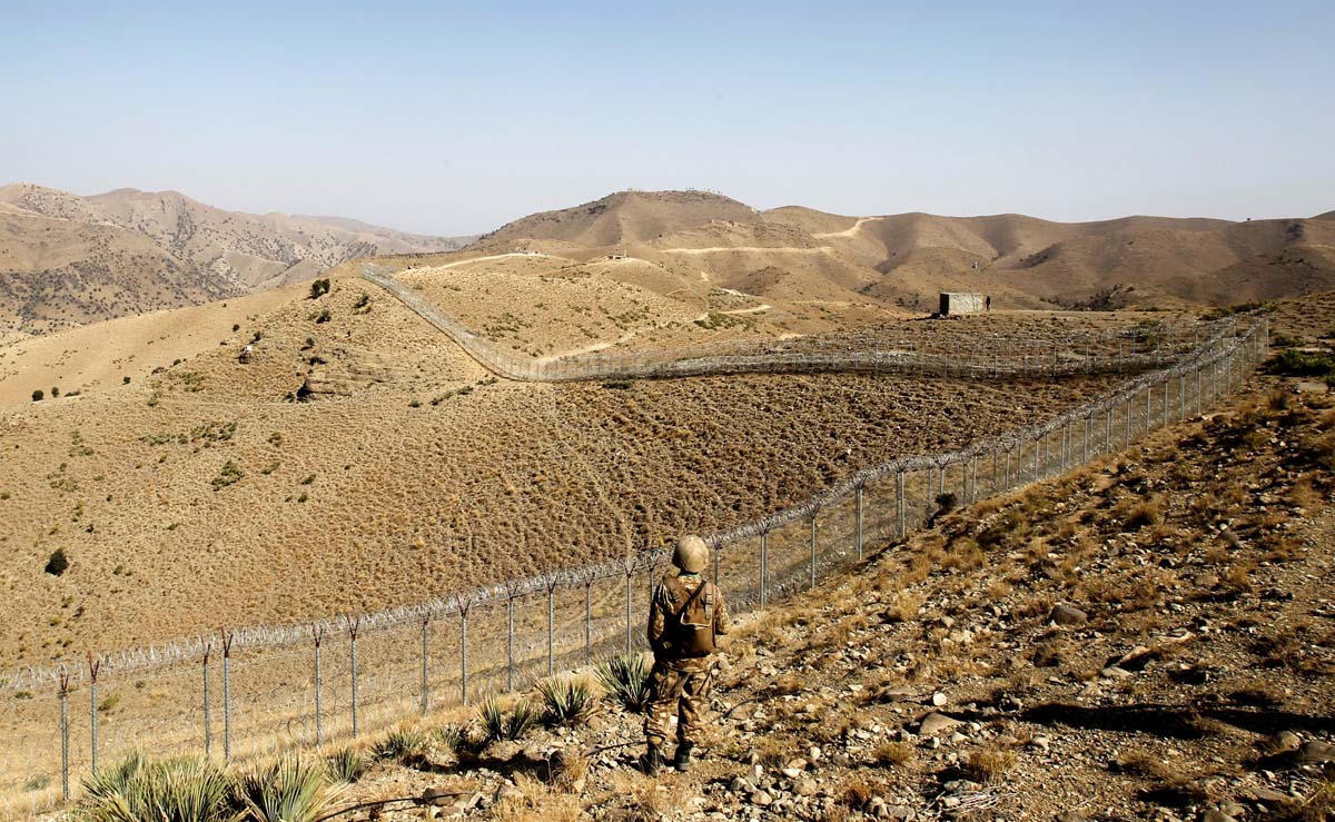 In this file photo, a soldier stands guard along the border fence outside the Kitton outpost on the border with Afghanistan in North Waziristan, Pakistan Oct. 18, 2017. (REUTERS)