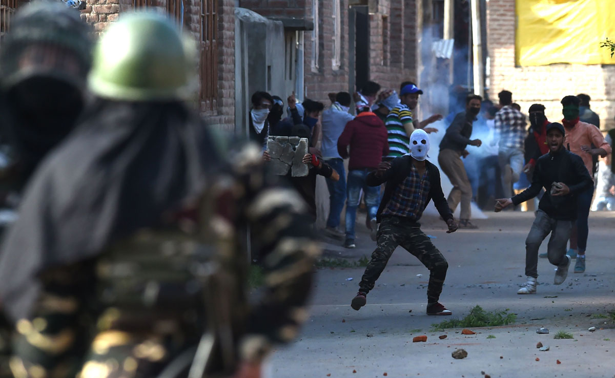 In this file photo, Kashmiri protesters clash with Indian government forces during a protest against recent killings in Srinagar on April 13, 2018. (AFP)