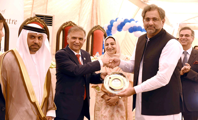 Prime Minister Shahid Khaqan Abbasi being presented with a memento after inauguration of Diabetes Center at Phulgran on April 27, Ambassador of UAE to Pakistan H.E Hamad Obaid Ibrahim Salem AlZaabi is also Present (Photo by PID)