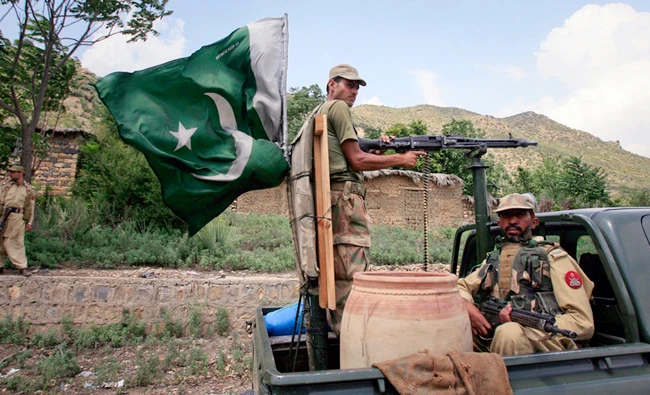 In this file photo, Pakistani soldiers patrol Tora Warai, a town in Kurram Agency, on the border with Afghanistan. (REUTERS)