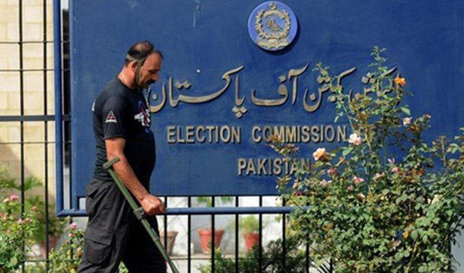 In this file photo, A security man walks outside the Election Commission of Pakistan building in Islamabad. (AFP)