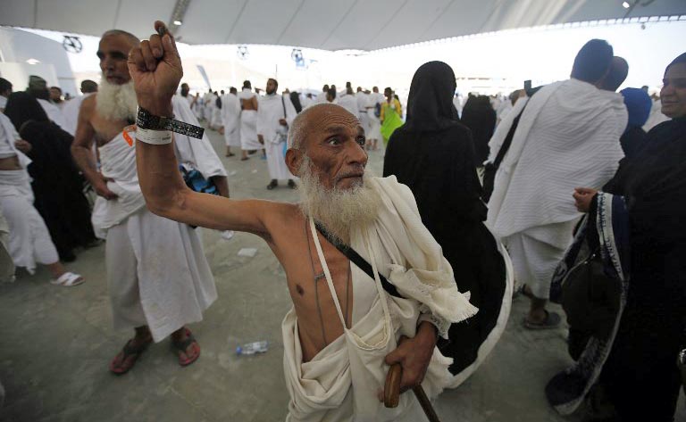 In this file photo, Muslim pilgrims throw pebbles at pillars during the "Jamarat" ritual, the stoning of Satan, in Mina near the holy city of Mecca, on Sept. 12, 2016. (AFP)