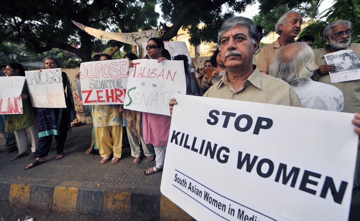 In this file photo, Pakistani human rights activists hold a protest over honor killing in Karachi on Sept 1, 2008. (AFP)