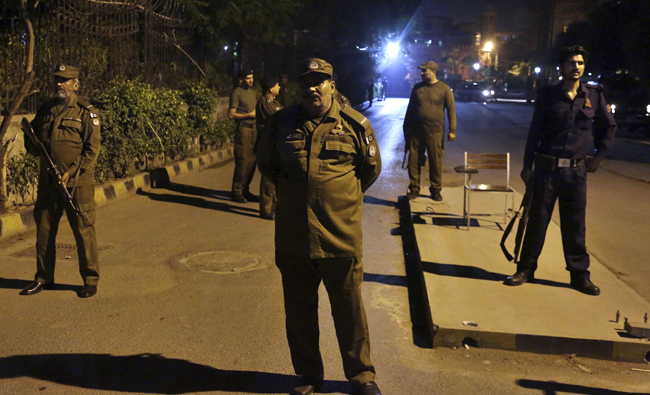 Pakistani police officers stand guard at a hospital, where Pakistan's injured Interior Minister Ahsan Iqbal being shifted for treatment, in Lahore, Pakistan on May 6, 2018. (AP)