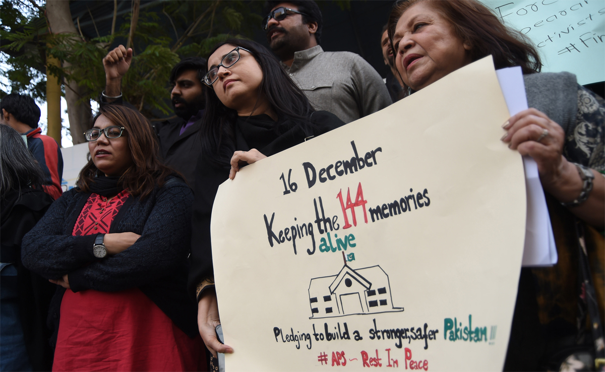 In this file photo, Pakistani human rights activists commemorate the third anniversary of Army Public School (APS) massacre in Karachi on Dec. 16, 2017. (AFP)