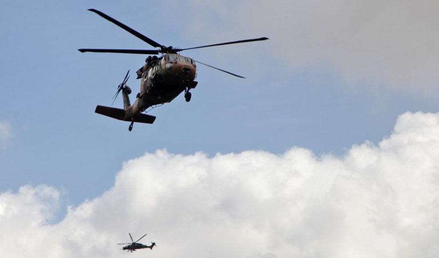 This file photo shows a Turkish army Black Hawk helicopter, front, and a T129 ATAK attack helicopter flying toward the village of Al-Maabatli in the Afrin region in the northwestern Aleppo province countryside as part of the ongoing offensive on March 2, 2018. (AFP)