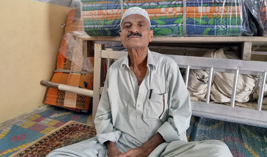 Abdul Jabbar alias Shaheen, an employee of the Union Council and former international football referee, shares memories and horrible story of his son Munna with Arab News. (AN photo)