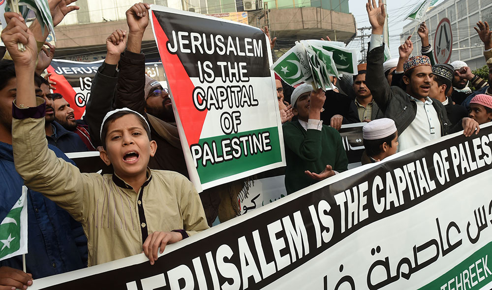 In this file photo, Pakistani demonstrators shout anti-US and Israel slogans in a rally in Lahore on December 14, 2017, following US President Donald Trump’s decision to officially recognize Jerusalem as the Israeli capital. (AFP)