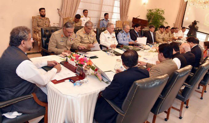 Prime Minister Shahid Khaqan Abbasi, left, chairing NSC meeting called to discuss Nawaz Sharif's interview given to local media outlet. (Photo courtesy: Radio Pakistan)
