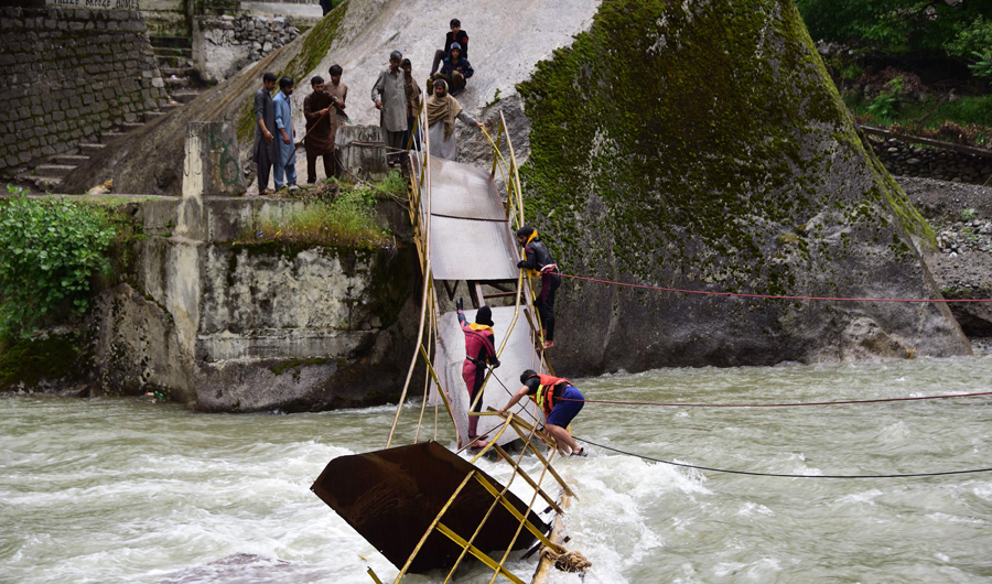 Pakistani rescuers search for missing university students after a bridge collapsed at Kundal Shahi, Neelum district, in Pakistani Kashmir. (AFP)