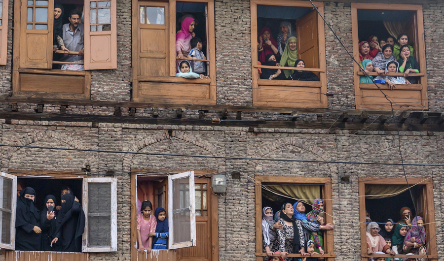 Kashmiri Muslims grieve as they watch the funeral procession of a local rebel Fayaz Ahmad Hamal, in Srinagar, Indian controlled Kashmir, Saturday, May 5, 2018. (AP)