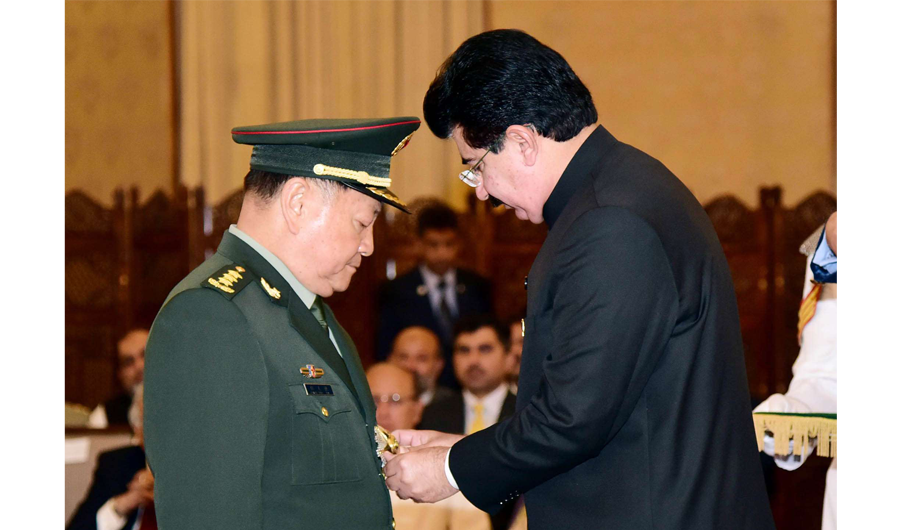 Acting President Muhammad Sadiq Sanjrani conferring the Nishan-i-Imtiaz military award on Gen. Zhang Youxia, vice chairman of the Chinese Central Military Commission. (Photo courtesy: Press Information Department)