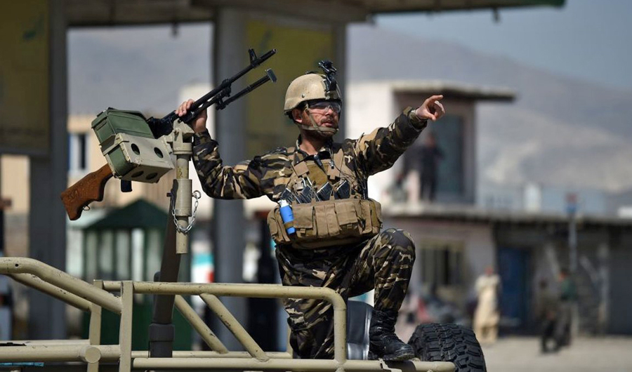 In this file photo, a member of the Afghan security forces secures the site of a car bomb attack in Kabul on March 17, 2018. (AFP)