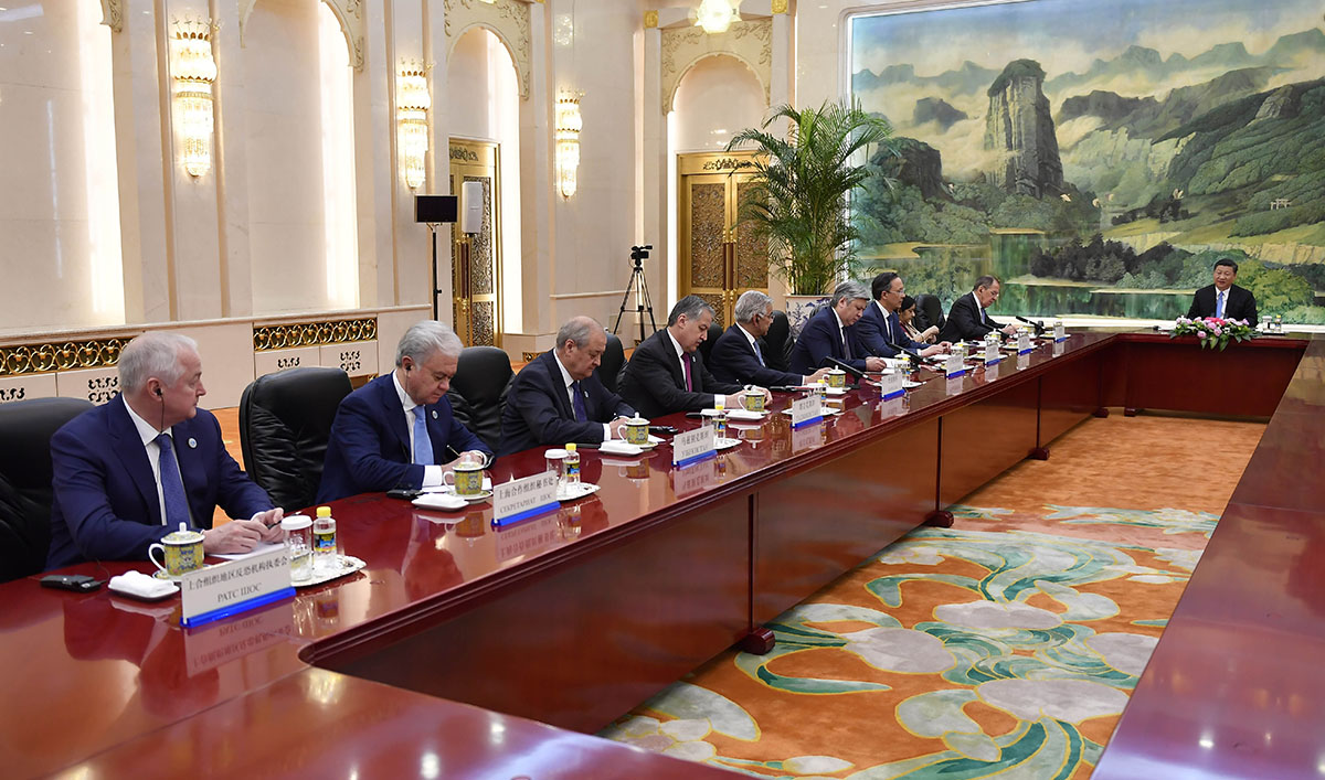 In this file photo, heads of the delegation of the Shanghai Cooperation Organisation (SCO) having a meeting with Chinese President Xi jinping (R) at the Great Hall of the People in Beijing on April 23, 2018. (AFP)
