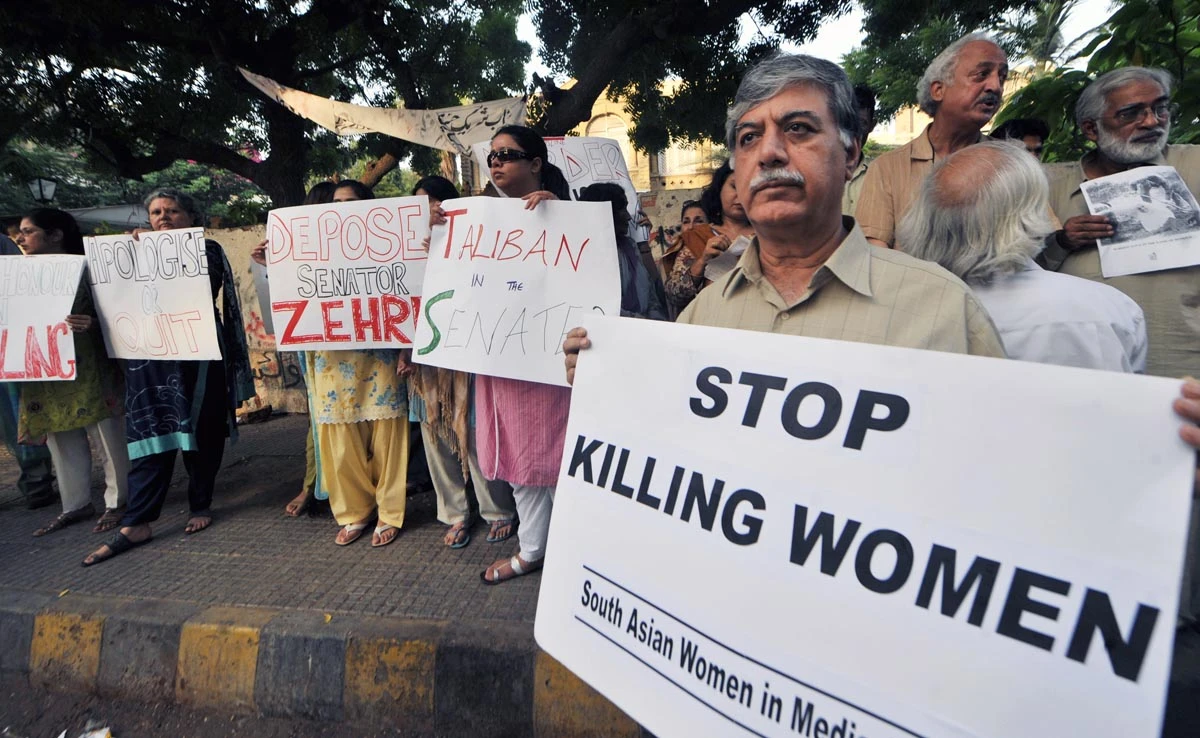 In this file photo, Pakistani human rights activists hold a protest over honor killing in Karachi on Sept 1, 2008. (AFP)