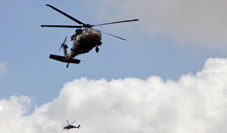 This file photo shows a Turkish army Black Hawk helicopter, front, and a T129 ATAK attack helicopter flying toward the village of Al-Maabatli in the Afrin region in the northwestern Aleppo province countryside as part of the ongoing offensive on March 2, 2018. (AFP)