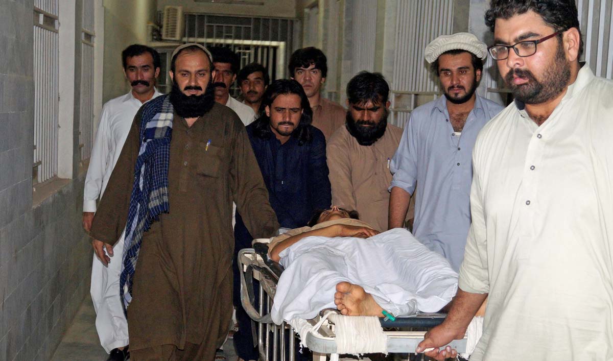People move a stretcher with an injured man, who was shot after militants attacked on a jirga (tribal assembly or public meeting) organized by the ethnic rights group Pashtun Tahaffuz Movement (PTM) in Wana, the main town in Pakistan’s South Waziristan tribal region, in early morning at a hospital in Dera Ismail Khan, Pakistan, June 4, 2018. (REUTERS)