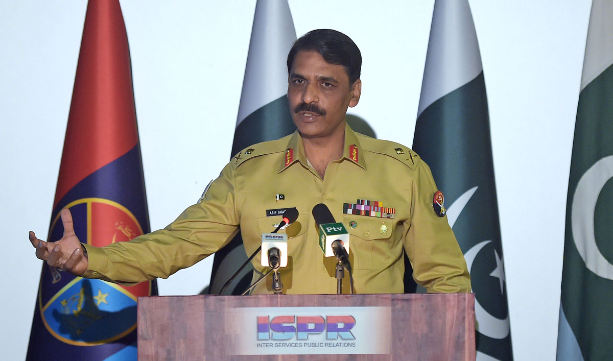 In this file photo, Pakistan’s army spokesman Major General Asif Ghafoor speaks with media representatives during a press conference in Rawalpindi on April 17, 2017. (AFP)