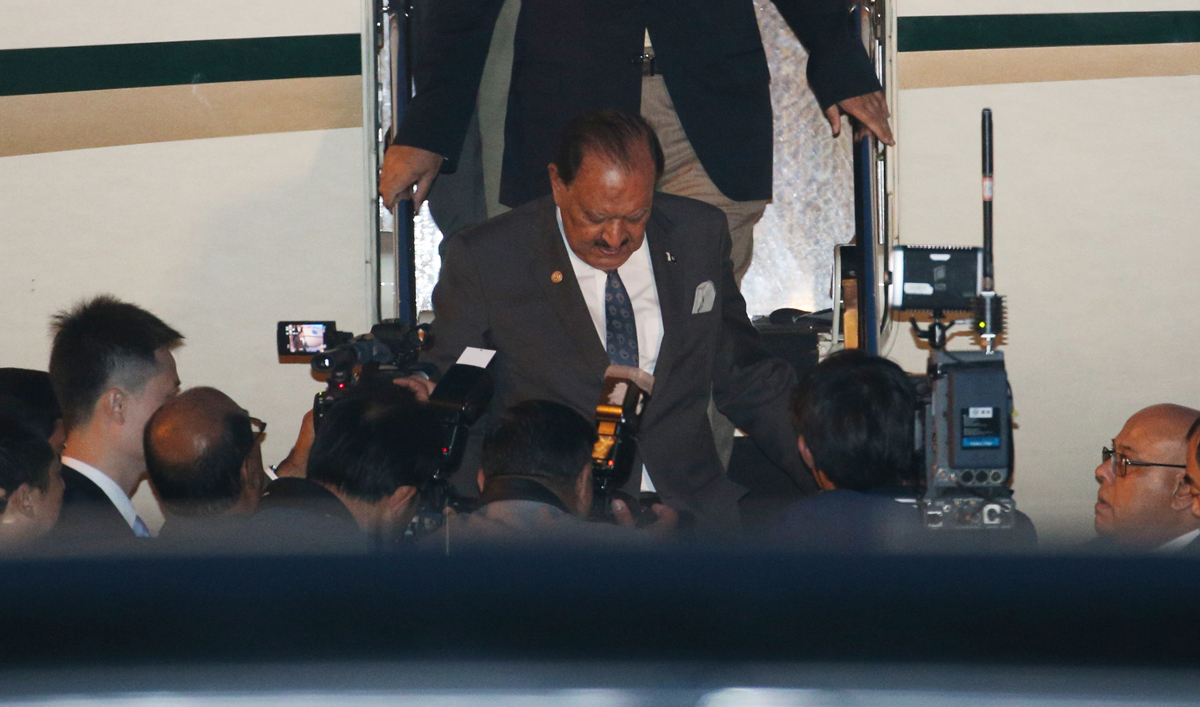 Pakistan's President Mamnoon Hussain disembarks from a plane upon his arrival at Qingdao Liuting International Airport for the 18th Shanghai Cooperation Organization (SCO) Summit in Qingdao, China's Shandong province on June 8, 2018. (Pool via AFP)