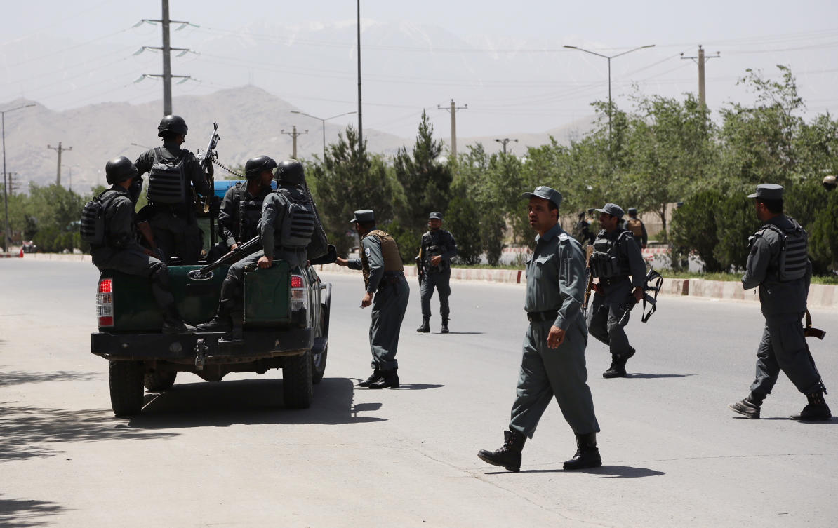 Security personnel arrive at the site of an attack in the Afghan Interior Ministry in Kabul, Afghanistan, Wednesday, May 30, 2018. (AP)