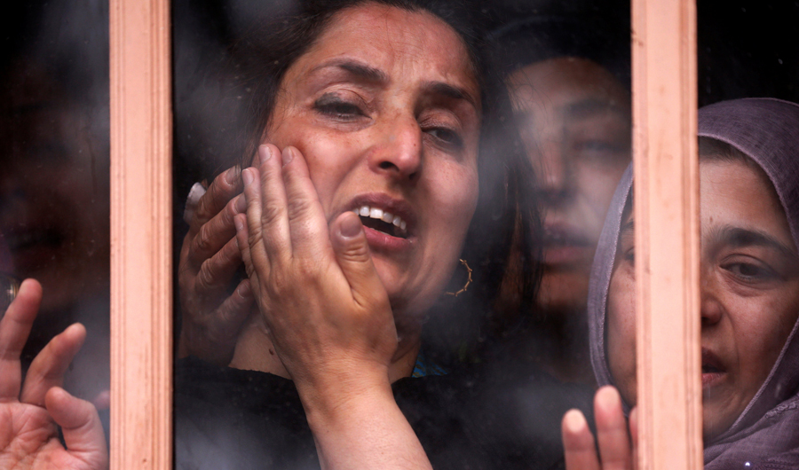 Wife of Syed Shujaat Bukhari, the editor-in-chief of local newspaper "Rising Kashmir", who according to local media was killed by unidentified gunmen outside his office in Srinagar. (Reuters)