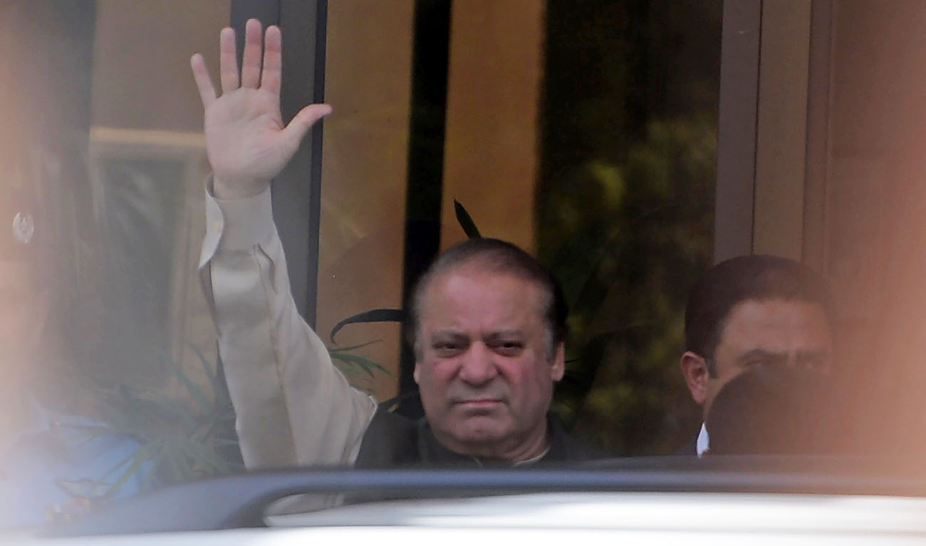 In this file photo, Pakistan's then Prime Minister Nawaz Sharif waves as he arrives to appear before an anti-corruption commission at the Federal Judicial Academy in Islamabad on June 15, 2017. (AAMIR QURESHI/AFP)