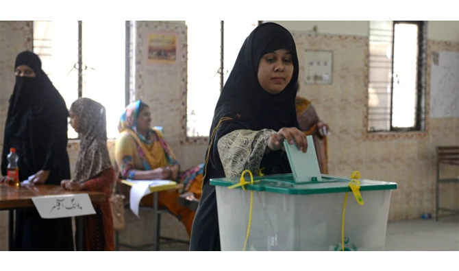 In this file photo, Pakistani voter casts her ballot in a by-election in Lahore on Sept. 17, 2017. (AFP)