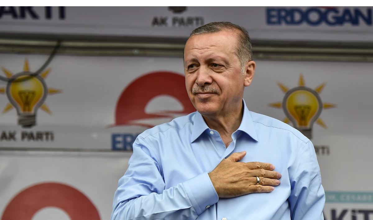 In this file photo, Turkish President Recep Tayyip Erdogan salutes party supporters during a rally on the eve of the elections in Istanbul on June 23, 2018. (Aris MESSINIS/AFP)