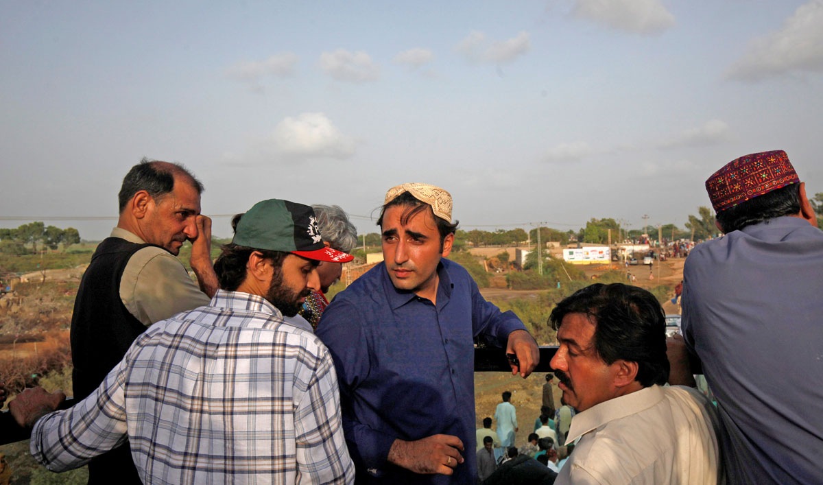 In this file photo, Bilawal Bhutto Zardari, chairman of the Pakistan People’s Party (PPP) speaks to party workers on the roof of his bullet-proof bus in Thatta District, Pakistan, July 2, 2018. (AKHTAR SOOMRO/REUTERS)