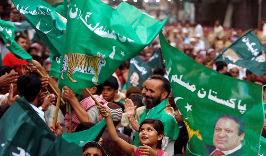 Supporters of Pakistan Muslim League - Nawaz (PML-N) waving the party flags. Punjab province is traditionally the strong hold of (PML-N). (REUTERS)