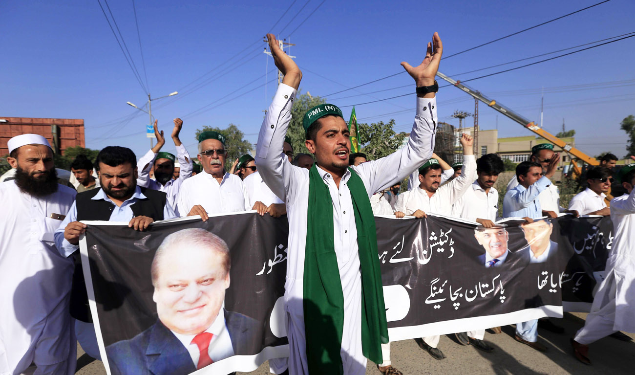 In this file photo, supporters of Pakistan Muslim League-Nawaz (PML-N) chants slogans after the sentencing decision against former prime minister Nawaz Sharif, during a protest in Peshawar on July 6, 2018. (ABDUL MAJEED/AFP)
