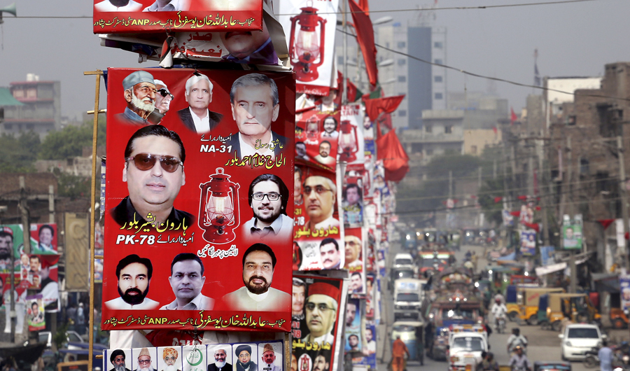 Election banners for the Pakistani secular Awami National Party line a road in Peshawar, Pakistan, on July 11, 2018. (AP)