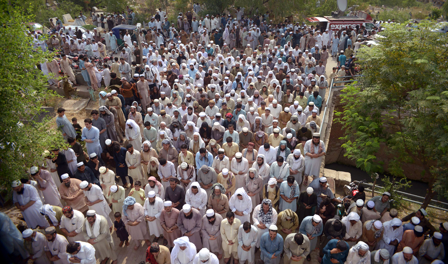 Pakistani residents offer funeral prayers for blast victims, who were killed in a suicide bombing at an election rally, during their funeral in Peshawar on July 11, 2018. The death toll in a suicide bombing at an election rally in northwestern Pakistan rose to 20 as Taliban militants claimed responsibility, officials said, in the first major attack ahead of July 25 polls. (AFP)