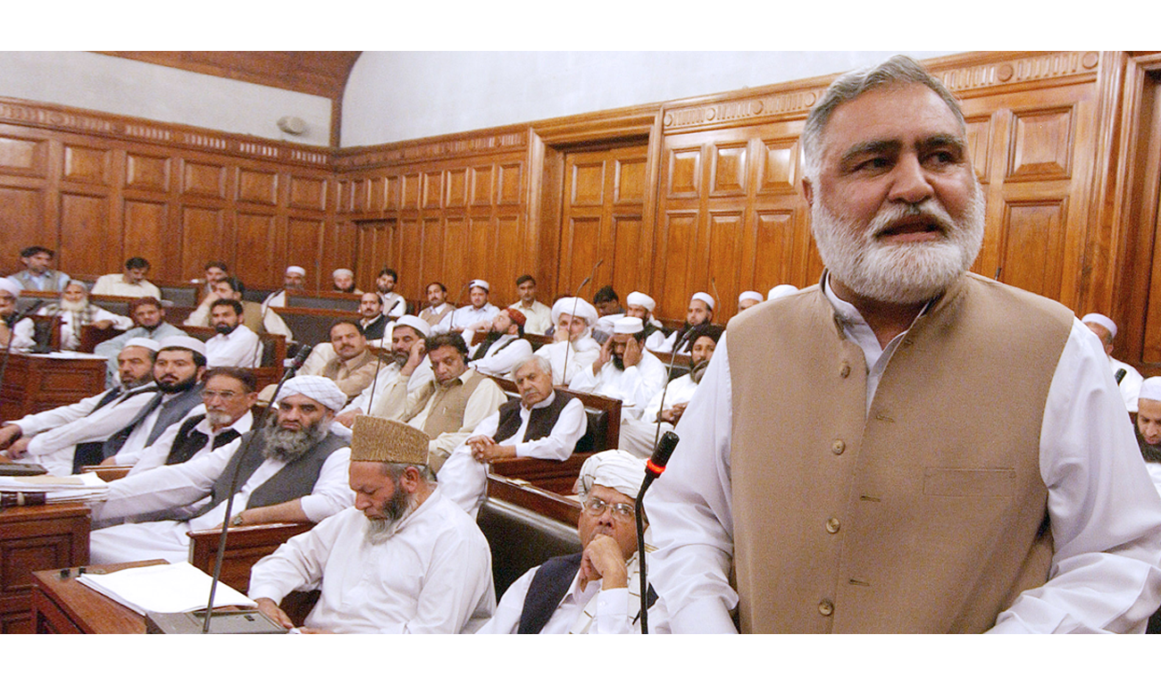 In this file photo, Pakistani North West Frontier Province (NWFP) Chief Minister Akram Durrani, right, delivers a speech at the provincial assembly in Peshawar, Nov. 12, 2006. (TARIQ MAHMOOD/AFP)