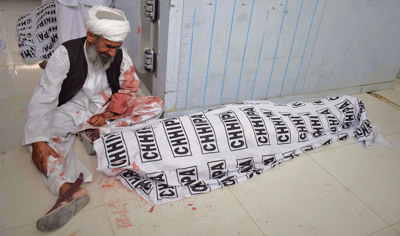 A Pakistani man mourns the death of a relative after a bomb blast at an election rally, at a hospital in Quetta on July 13, 2018. (BANARAS KHAN/AFP)