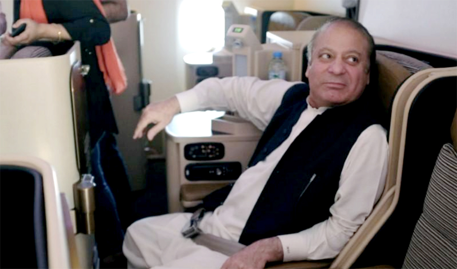 Ousted Pakistani Prime Minister Nawaz Sharif sits on a plane after landing at the Allama Iqbal International Airport in Lahore, Pakistan, July 13, 2018. (REUTERS)