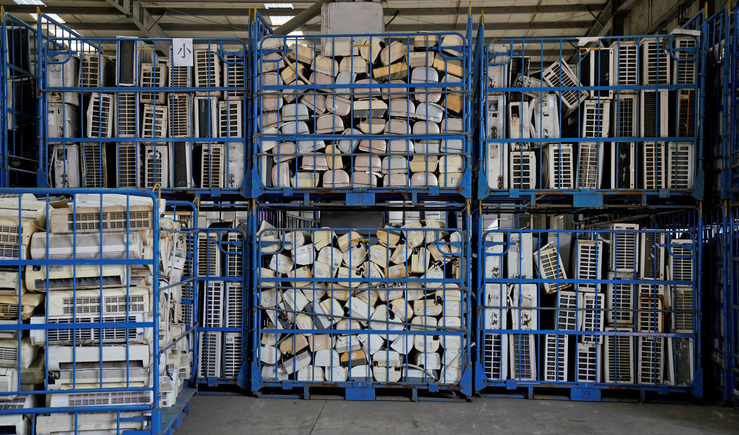 In this file photo, air conditioners about to be recycled are seen in a warehouse at the government-sponsored recycling park in the township of Guiyu, Guangdong Province, China, Jan. 12, 2018. (ALY SONG/REUTERS)